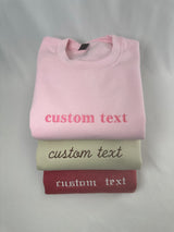 a stack of three t - shirts sitting on top of each other