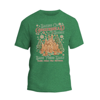 A green t-shirt with a graphic design depicting a gingerbread house and the text "Baking Co. Gingerbread Bakery"