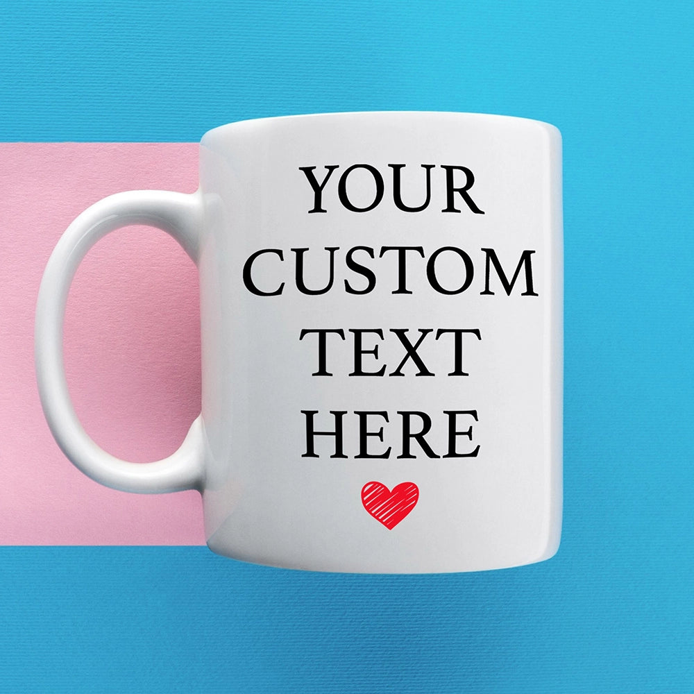 a white coffee mug with a red heart on it