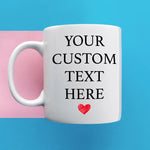 a white coffee mug with a red heart on it