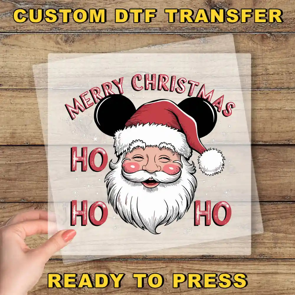 a hand holding a piece of paper with a santa clause on it