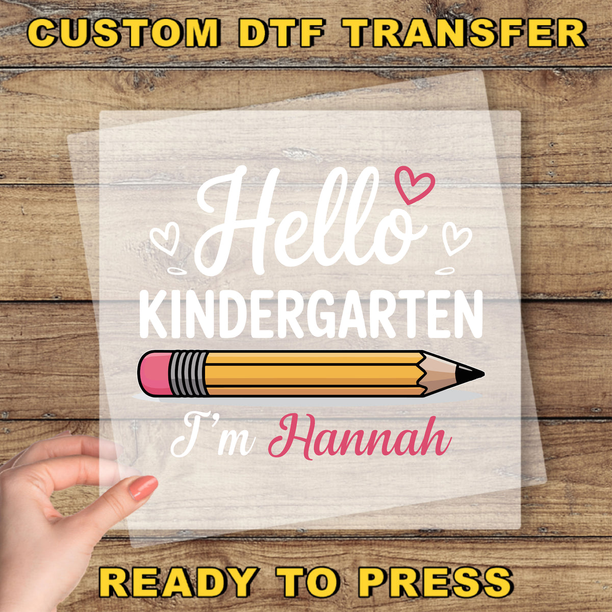 A hand holding a piece of paper with a pencil and the text "Hello Kindergarten I'm Hannah" printed on it.