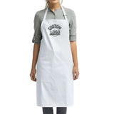a woman wearing a white apron with a black logo on it