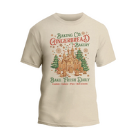 A t-shirt design featuring a gingerbread house and text promoting a bakery.