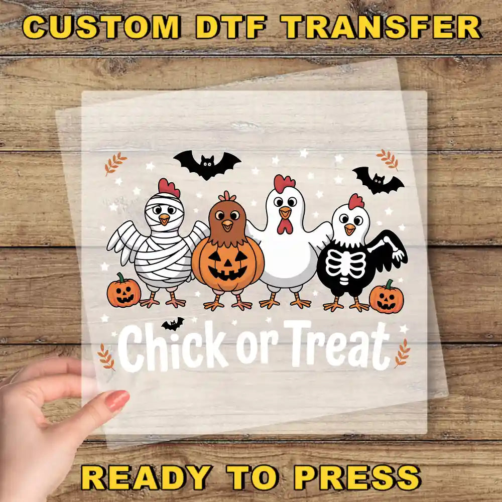 A hand is holding a clear sheet with a Halloween-themed illustration of a group of cartoon chickens, including a skeleton chicken, a pumpkin, and bats. The text "Chick or Treat" is displayed below the illustration.