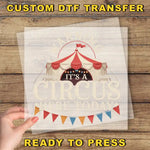 a person holding a piece of paper with a circus tent on it