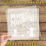 a person holding a piece of paper with the words midnight margaritas ready to press