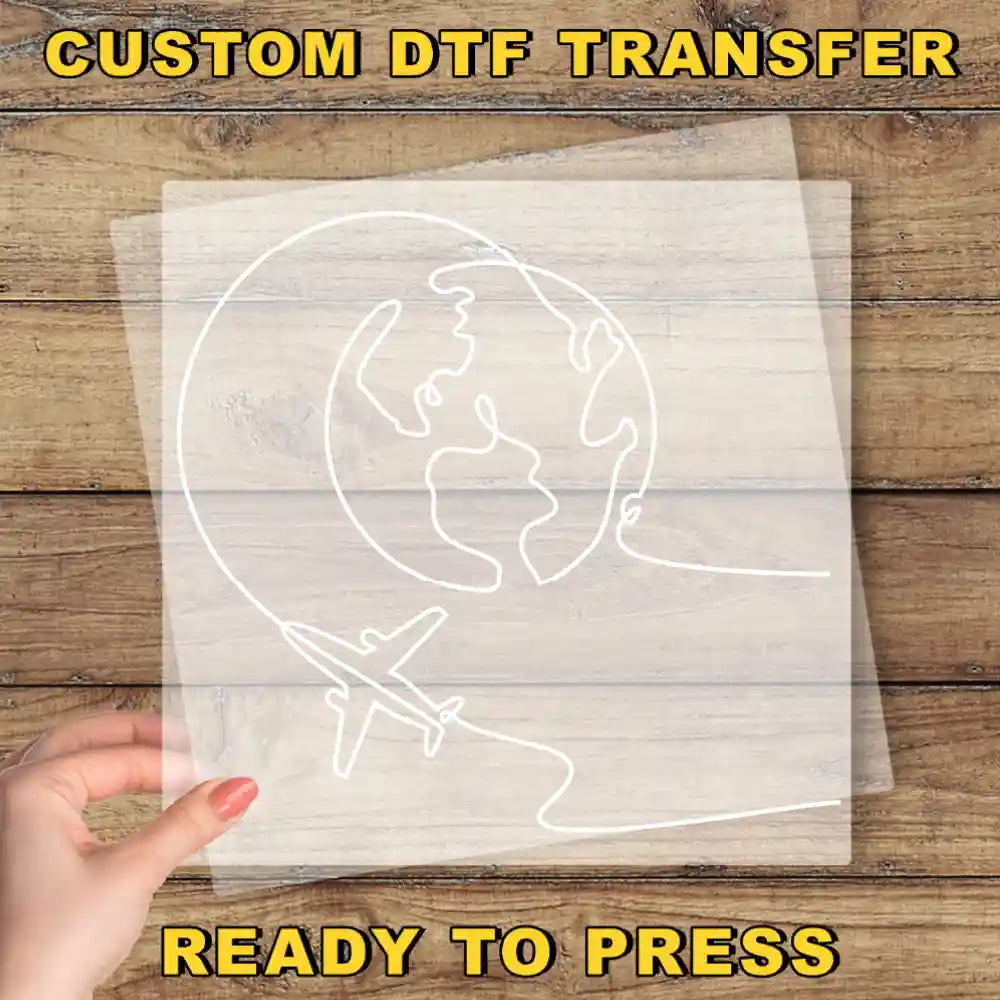 a person holding a piece of paper with a drawing of a plane on it
