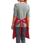 a woman wearing a red apron and grey shirt