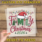 The image is a hand holding a transparent sheet with a festive Christmas-themed design, including a Santa hat, Christmas lights, and a family tree.
