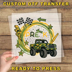 The image is a collage of various images, including a truck, checkered flags, stars, and lightning bolts, all set against a wooden background. The phrase "CUSTOM DTF TRANSFER" is visible at the top, and "READY TO PRESS" is at the bottom, indicating that the image is ready to be printed or transferred.