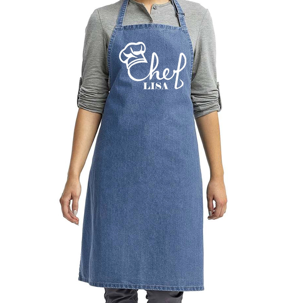a woman wearing a chef's apron with the word chef on it