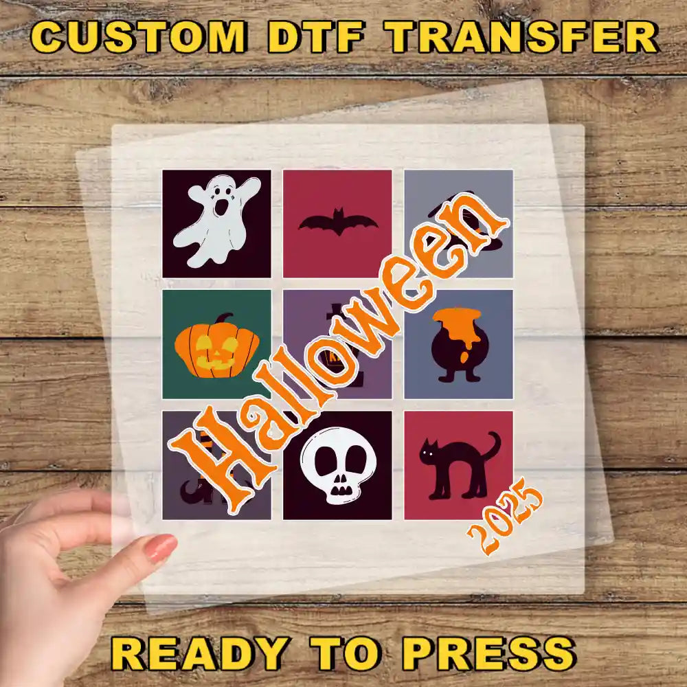 a hand holding a piece of paper with halloween images on it