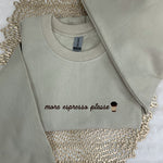 a white shirt with a cupcake embroidered on it