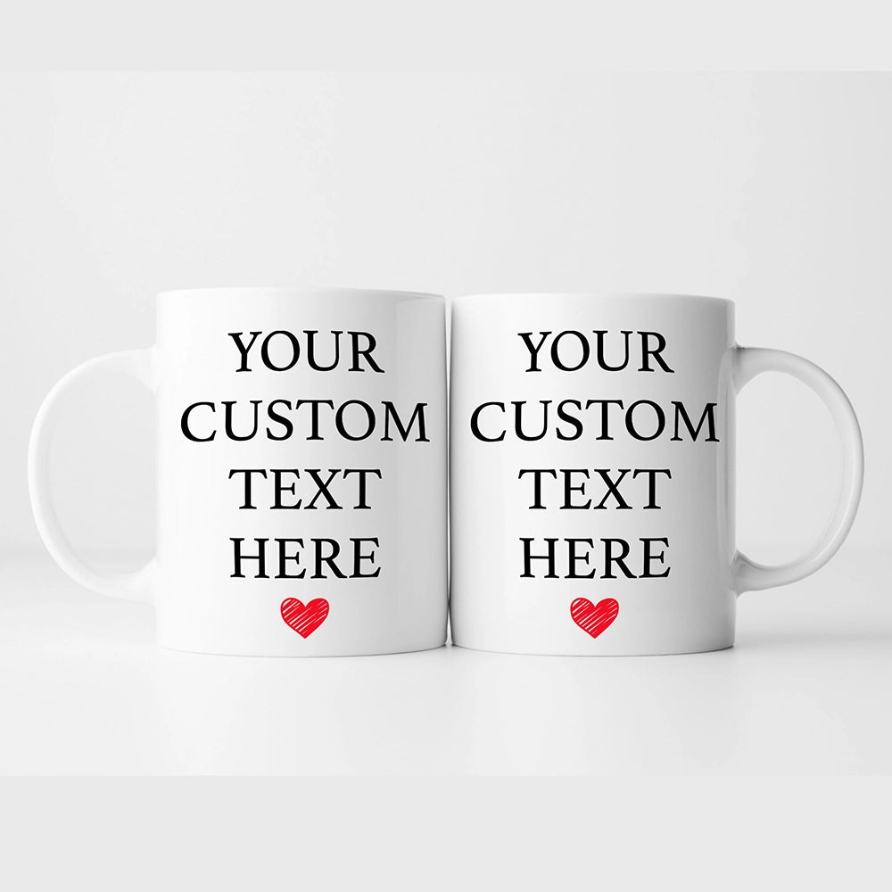 two white coffee mugs with red hearts on them
