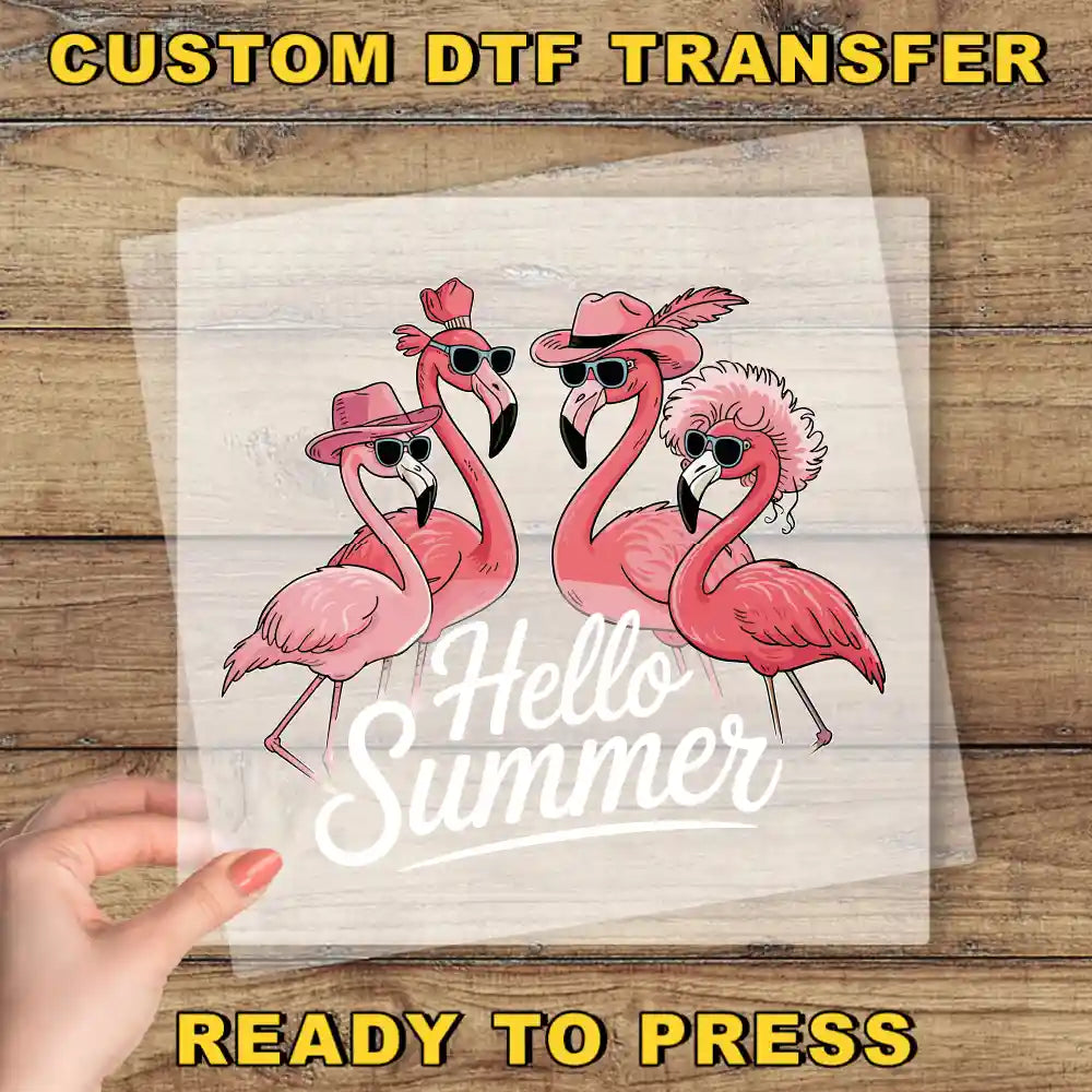 a person holding up a paper with flamingos on it