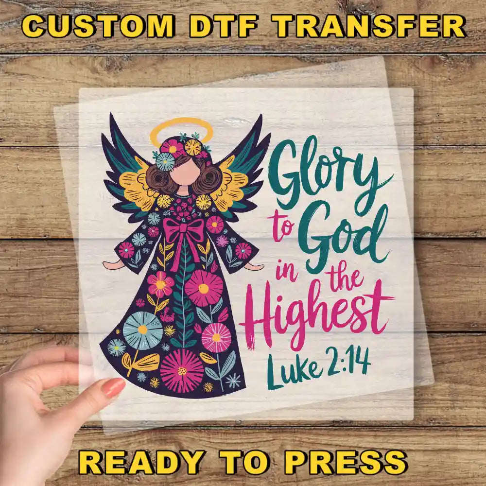 a hand holding a paper with a picture of an angel on it