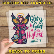 a hand holding a paper with a picture of an angel on it