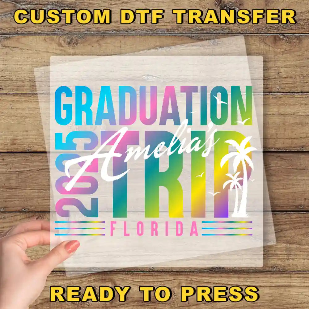 a person holding a piece of paper with the words graduation spirit on it