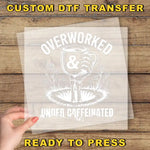 a person holding a piece of paper with the words overworked and under -