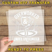 a person holding a piece of paper with the words overworked and under -