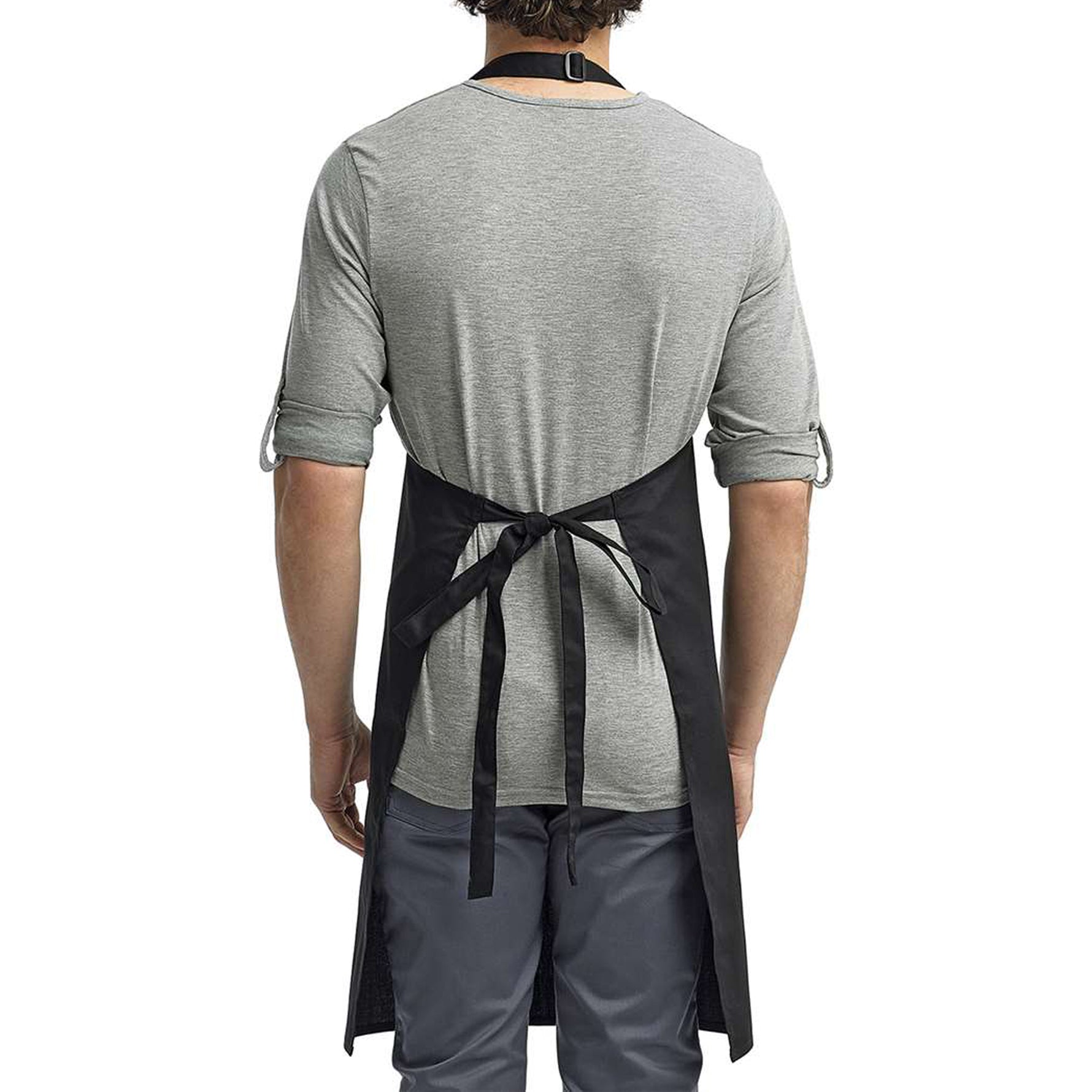 a man wearing a black apron and grey shirt
