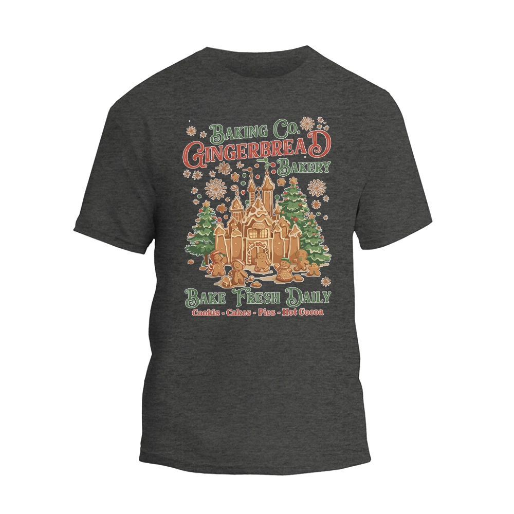 A gray t-shirt with a graphic design depicting a gingerbread house and the text "Baking Co. Gingerbread Bakes Daily Bake Fresh Daily Cookies Cakes - Plus Hot Chocolate".