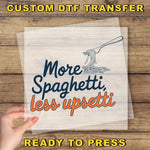 a hand holding a piece of paper with the words more spaghetti less upset ready to