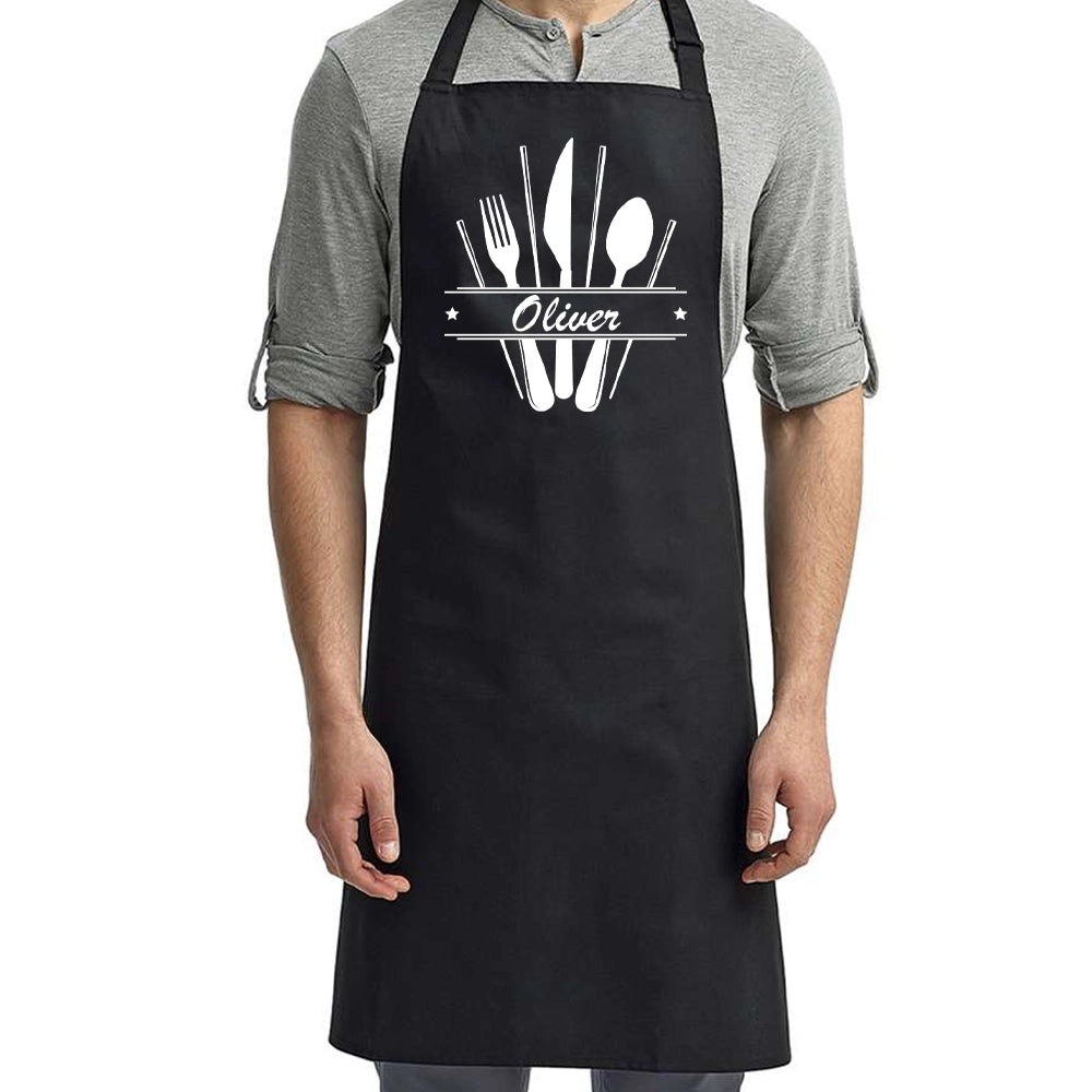 a man wearing an apron with a spoon and fork on it