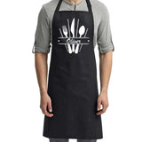 a man wearing an apron with a spoon and fork on it