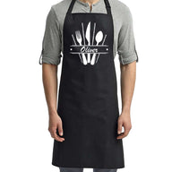 a man wearing an apron with a spoon and fork on it