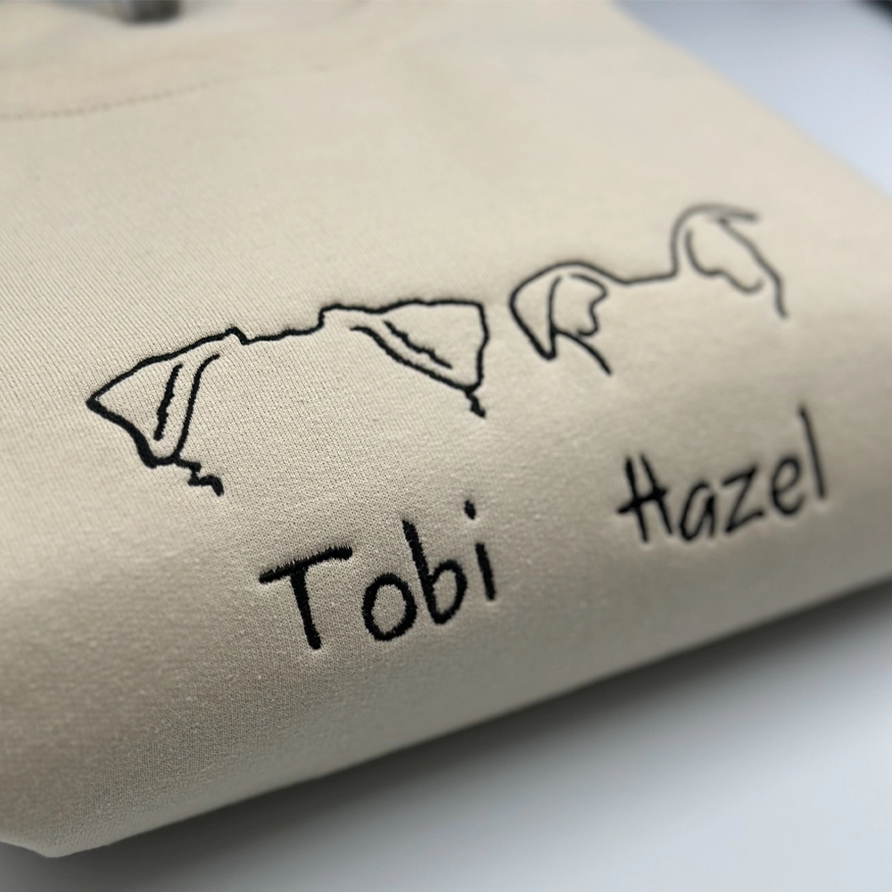 a close up of a t - shirt with the words tobi and tobi