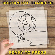 a hand holding a piece of paper with a drawing of a plane flying around the
