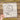 a hand holding a piece of paper with a drawing of a plane flying around the