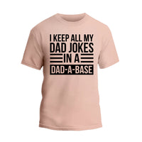 a pink t - shirt that says i keep all my dad jokes in a dad