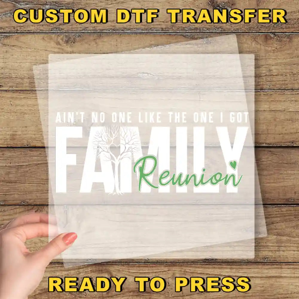 a person holding a piece of paper with the words family reunion printed on it
