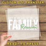 a person holding a piece of paper with the words family reunion printed on it