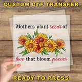 a hand holding a piece of paper with flowers on it