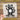 a sticker of a raccoon wearing sunglasses and holding a flag