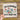 a hand holding a piece of paper with a picture of a knitting machine on it
