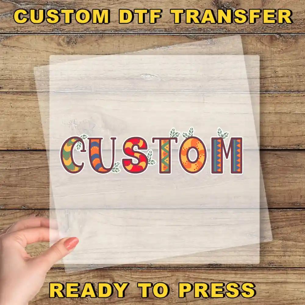 a hand holding a piece of paper with the word "CUSTOM" written on it, along with some colorful decorative elements.