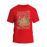 A red t-shirt with a graphic design depicting a gingerbread house and snowflakes, along with text that reads "Baking Co. Gingerbread's Bakery" and "Bake Fresh Daily".