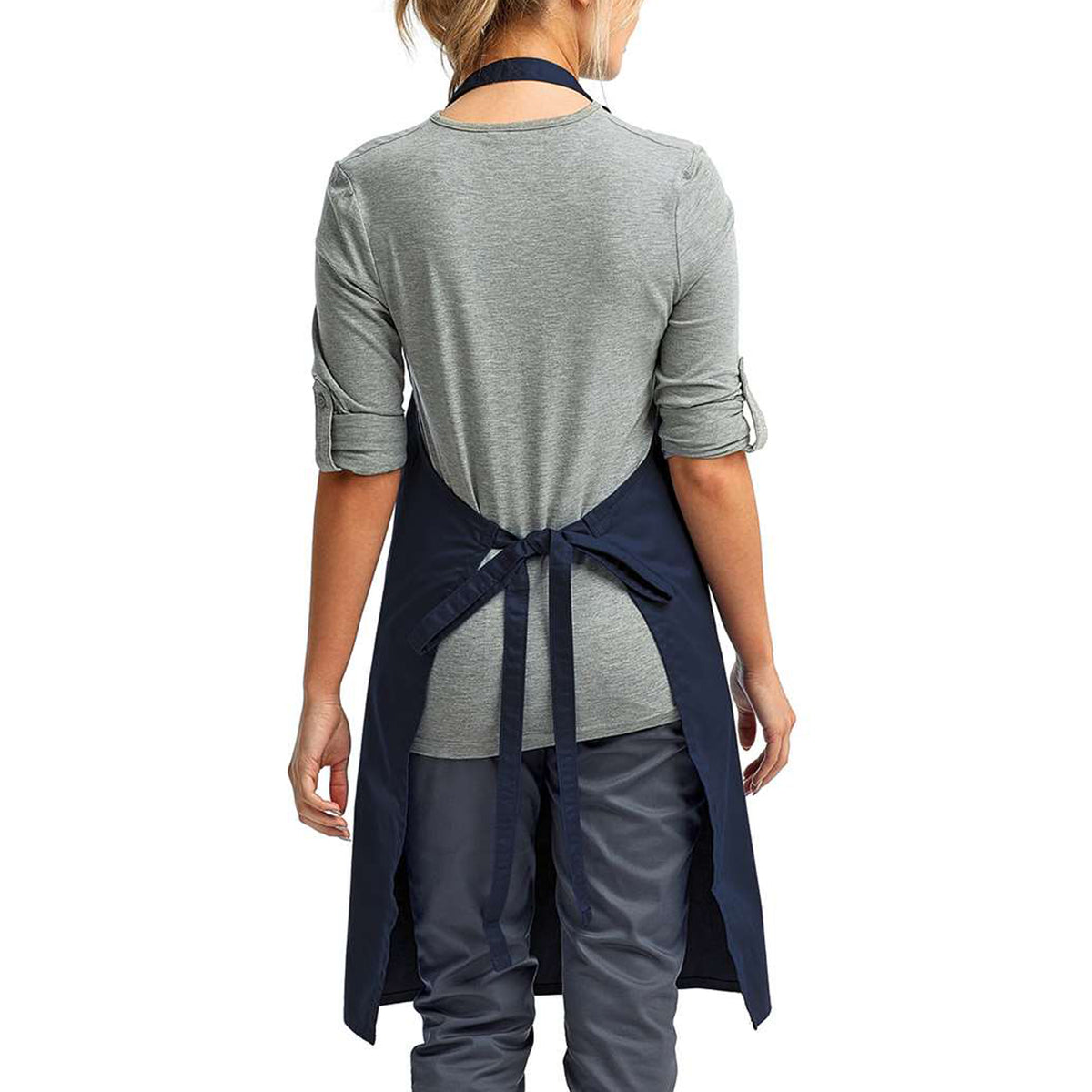 a woman wearing a grey shirt and blue apron