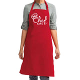 a woman wearing an apron with a chef's name on it