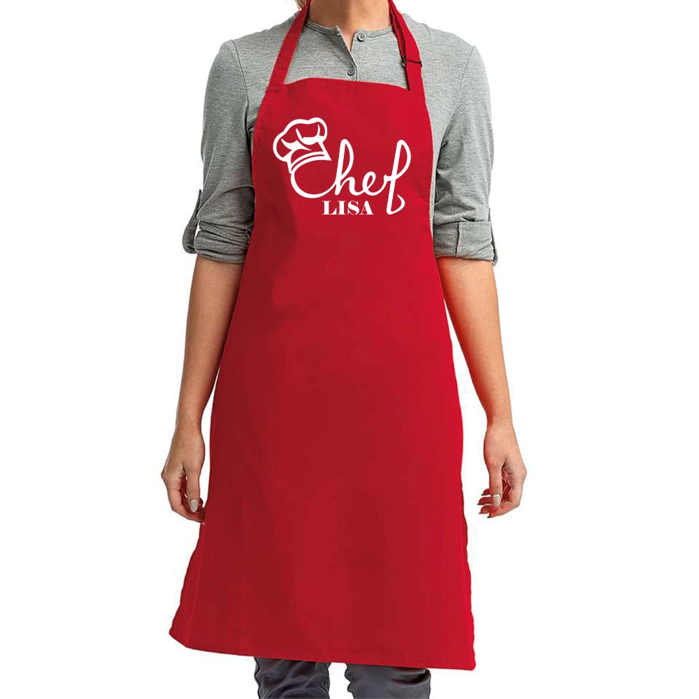 a woman wearing an apron with a chef's name on it