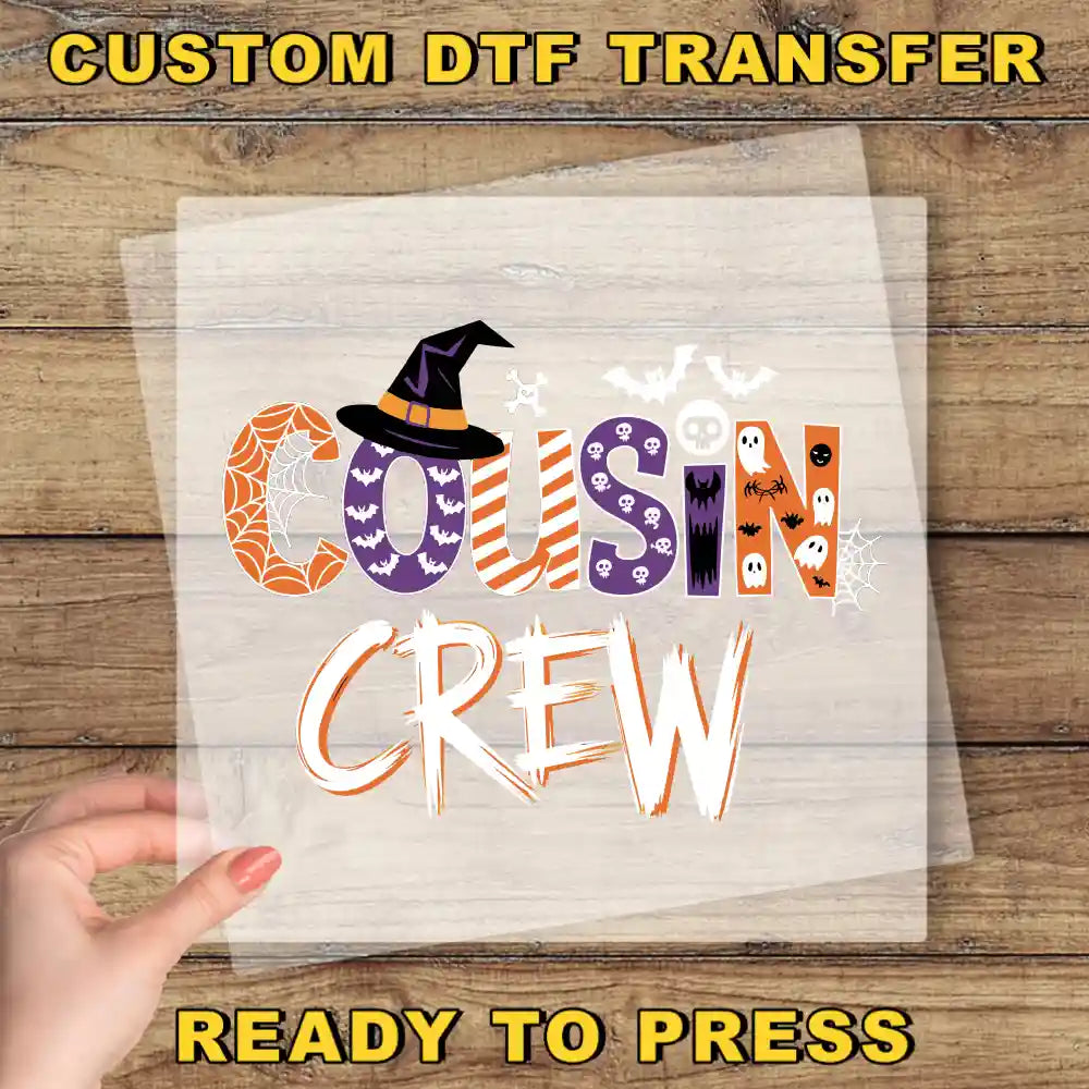 The image is a Halloween-themed graphic with the text "Cousin Crew" in a stylized font, featuring various Halloween-related elements such as bats, skulls, and a witch's hat.