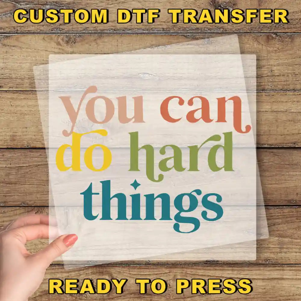 a hand holding a piece of paper that says, you can do hard things ready