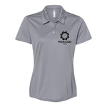 a women's polo shirt with a logo on the chest