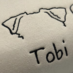 a close up of the word tobi written in black ink