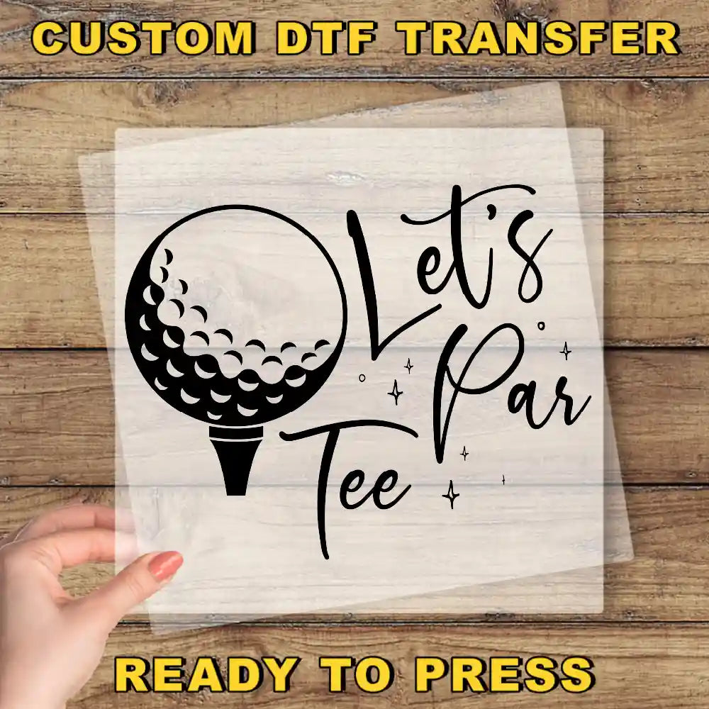 a person holding a piece of paper with a golf ball on it